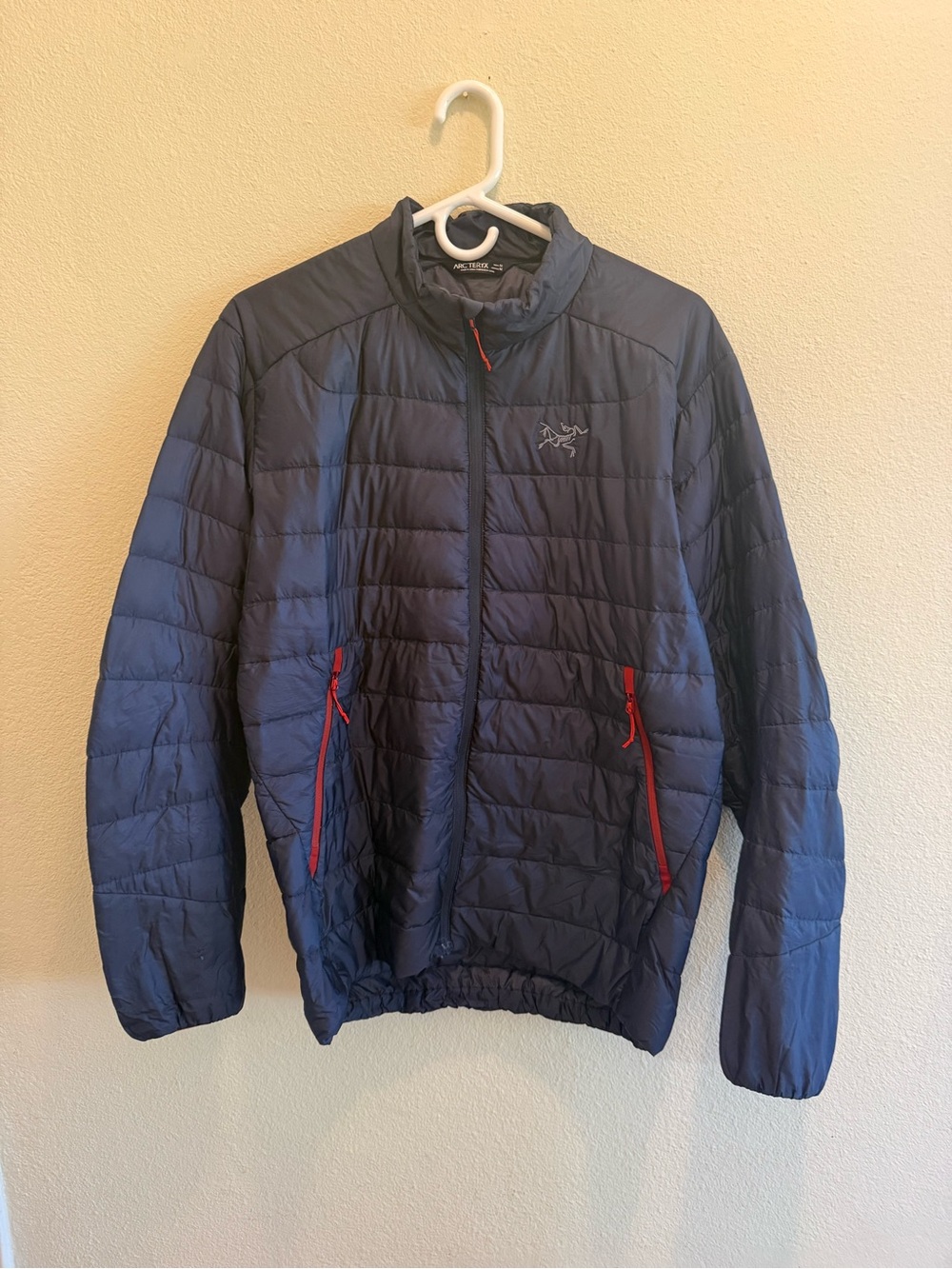 Arc'teryx Men's Navy Puffer Jacket with Red Zipper Accents